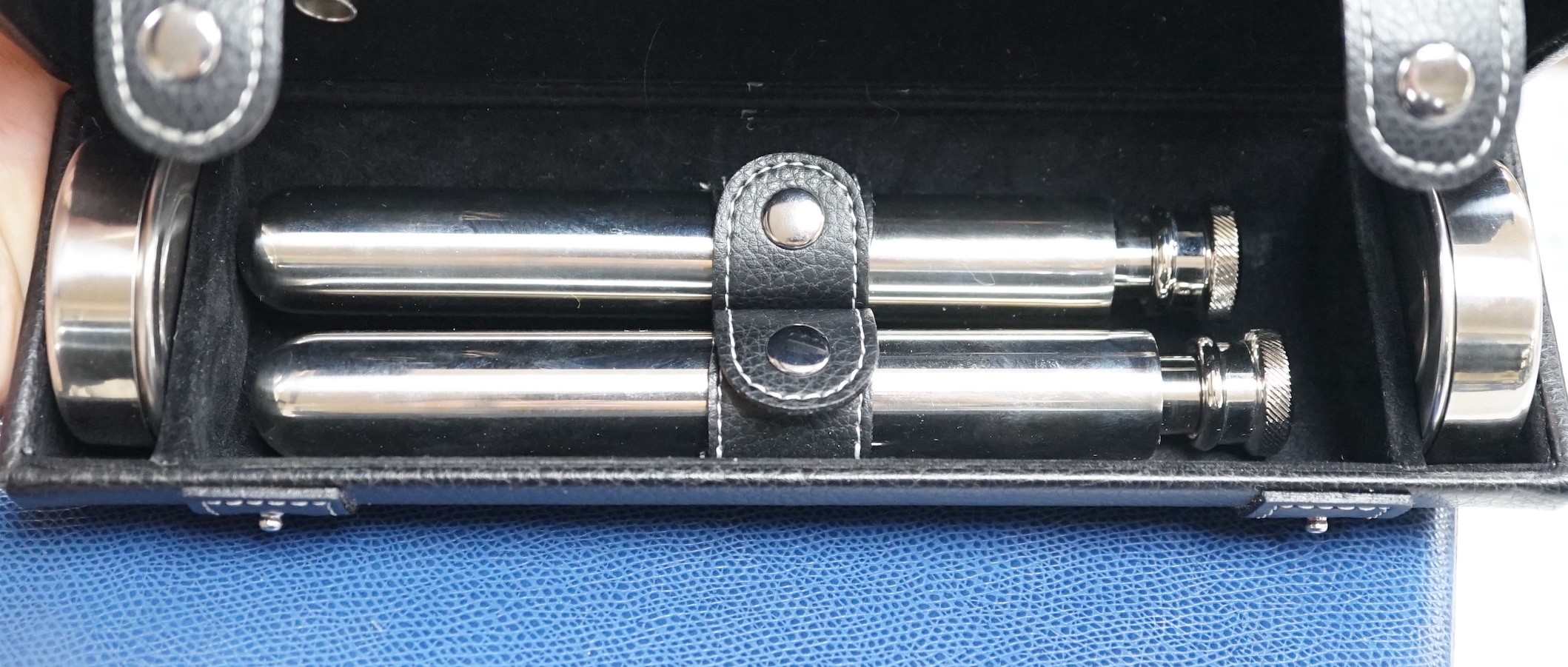 A cased novelty cocktail set and a Fortnum & Mason fitted leather case - combination lock 0000, 31cms wide x 18cms deep